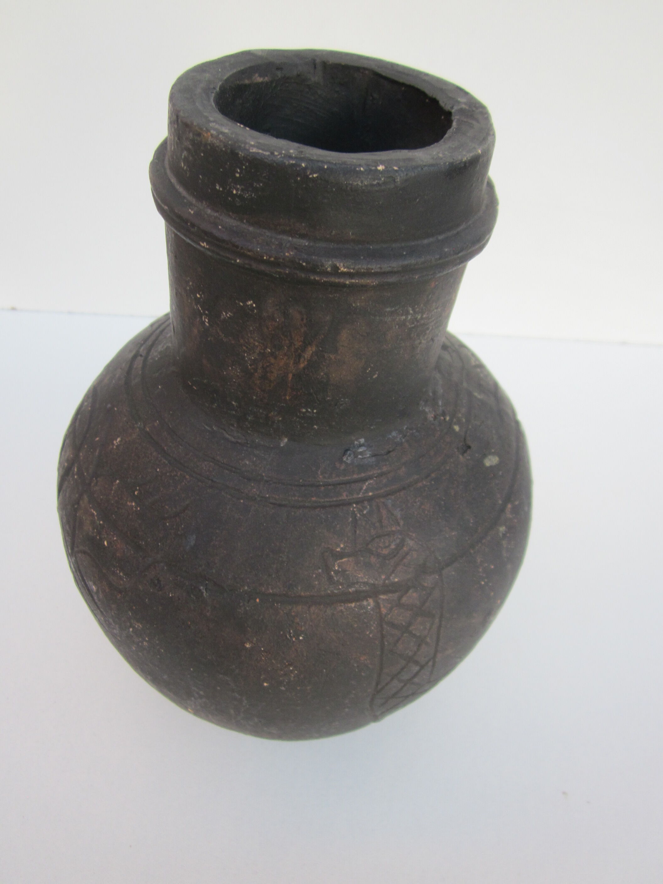 Black African pottery with stylized giraffe pattern
