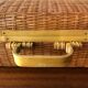 Vintage braided wicker suitcase