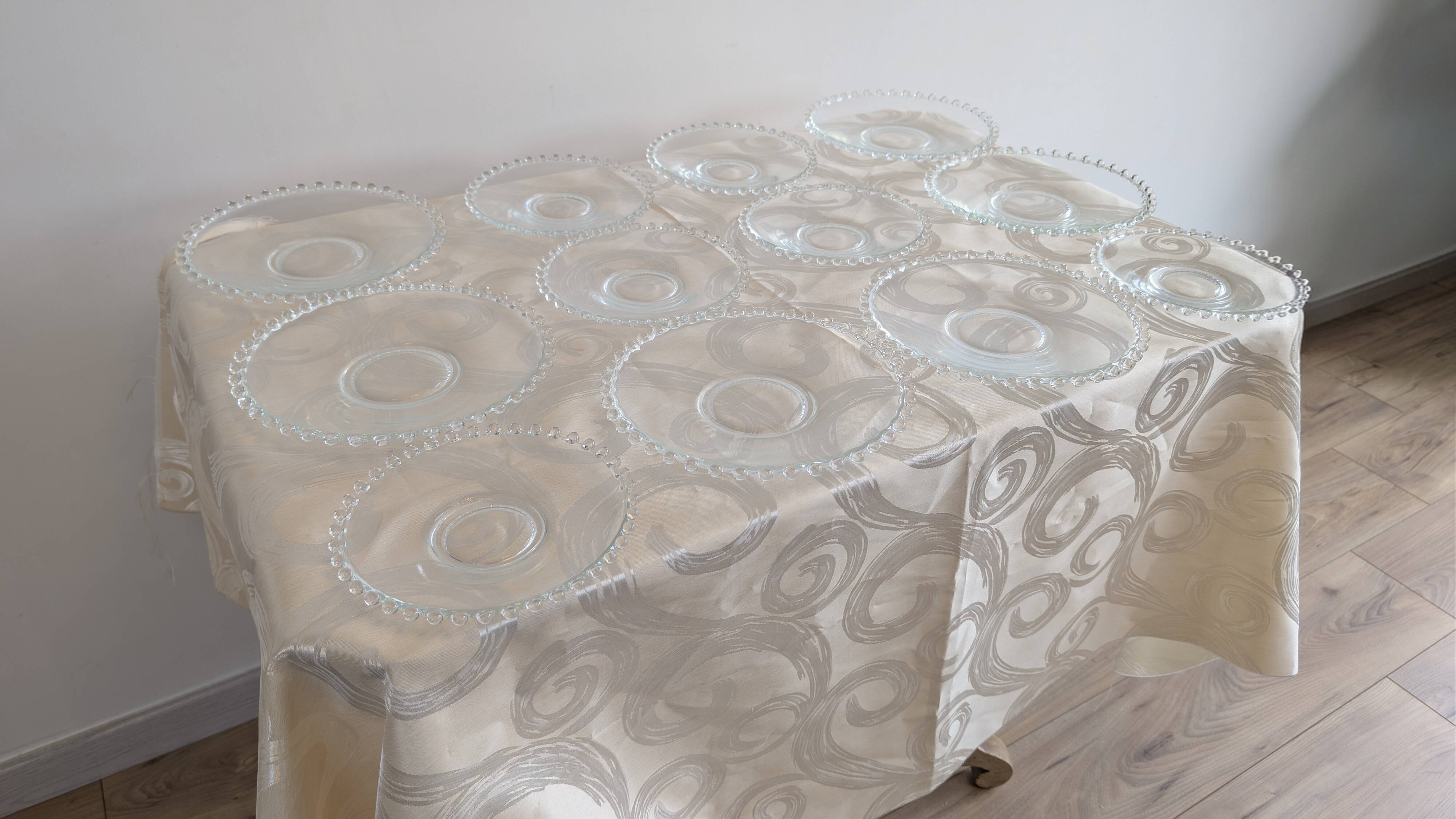 Vintage service of 12 pressed glass plates with bead decoration.