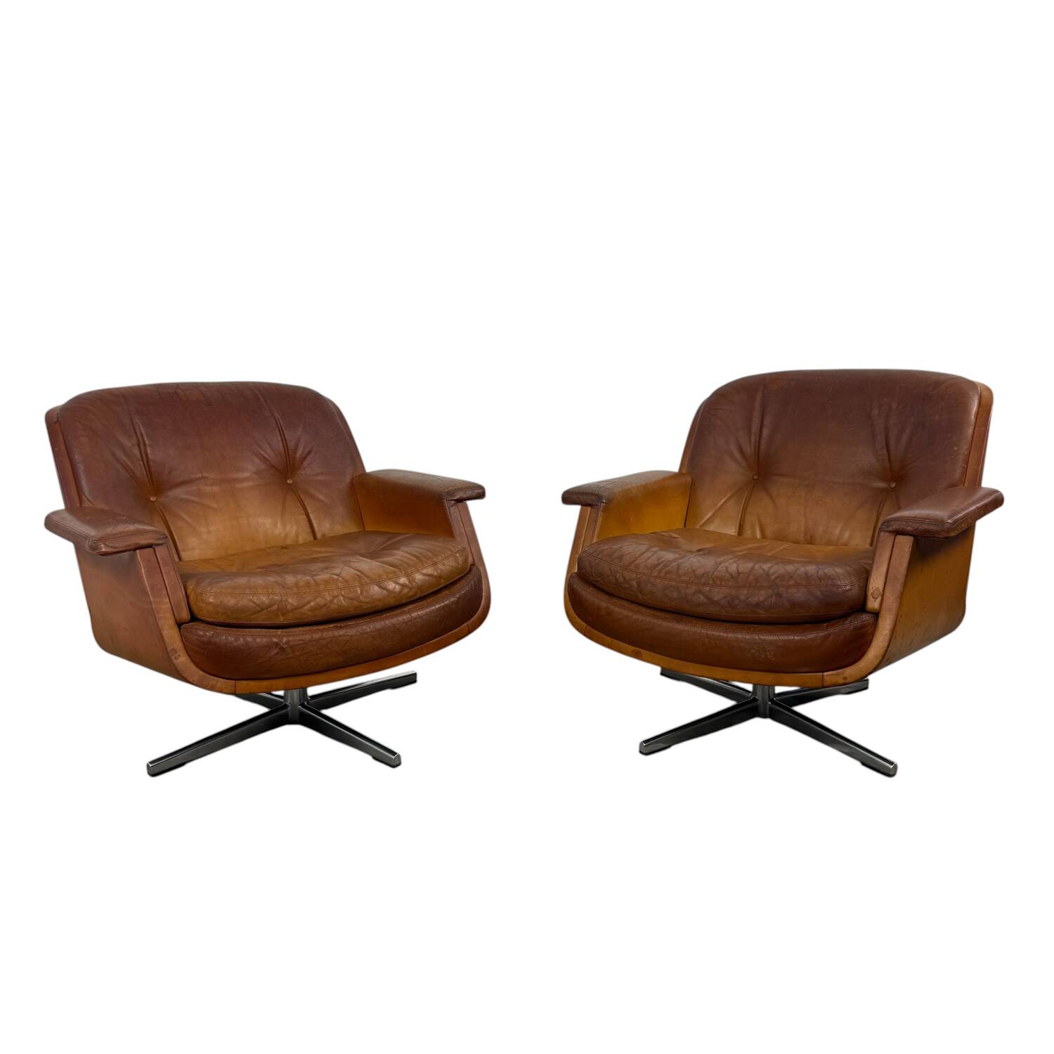 Paire de fauteuils pivotants vintage en cuir cognac par Eugen Schmidt