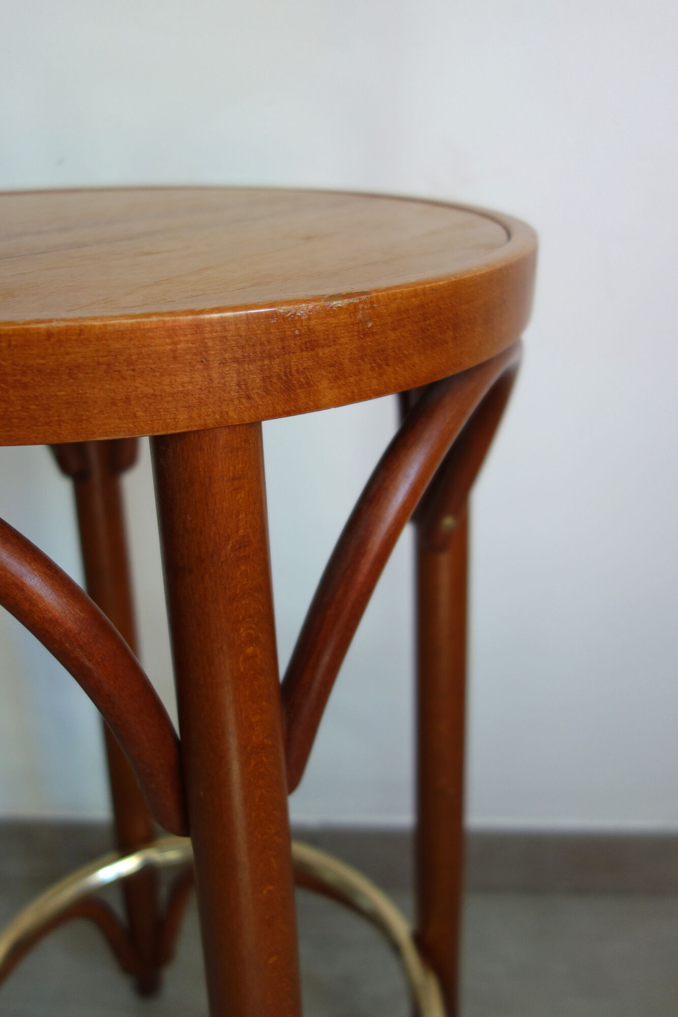 Former curved wooden bistro stool