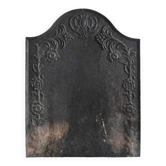 Old cast iron fireplace plaque