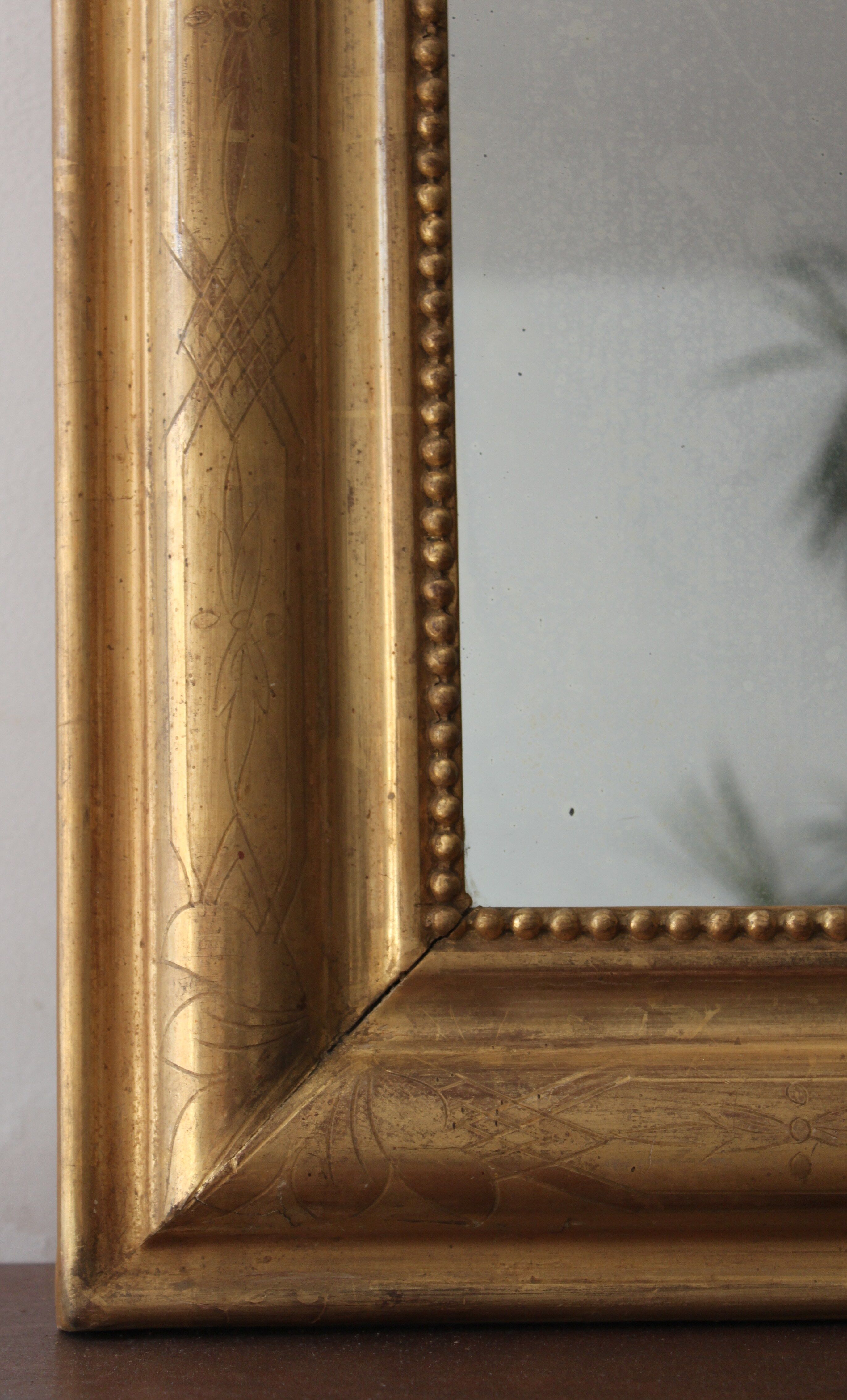 Old gilded mirror with A pediment