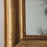 Old gilded mirror with A pediment