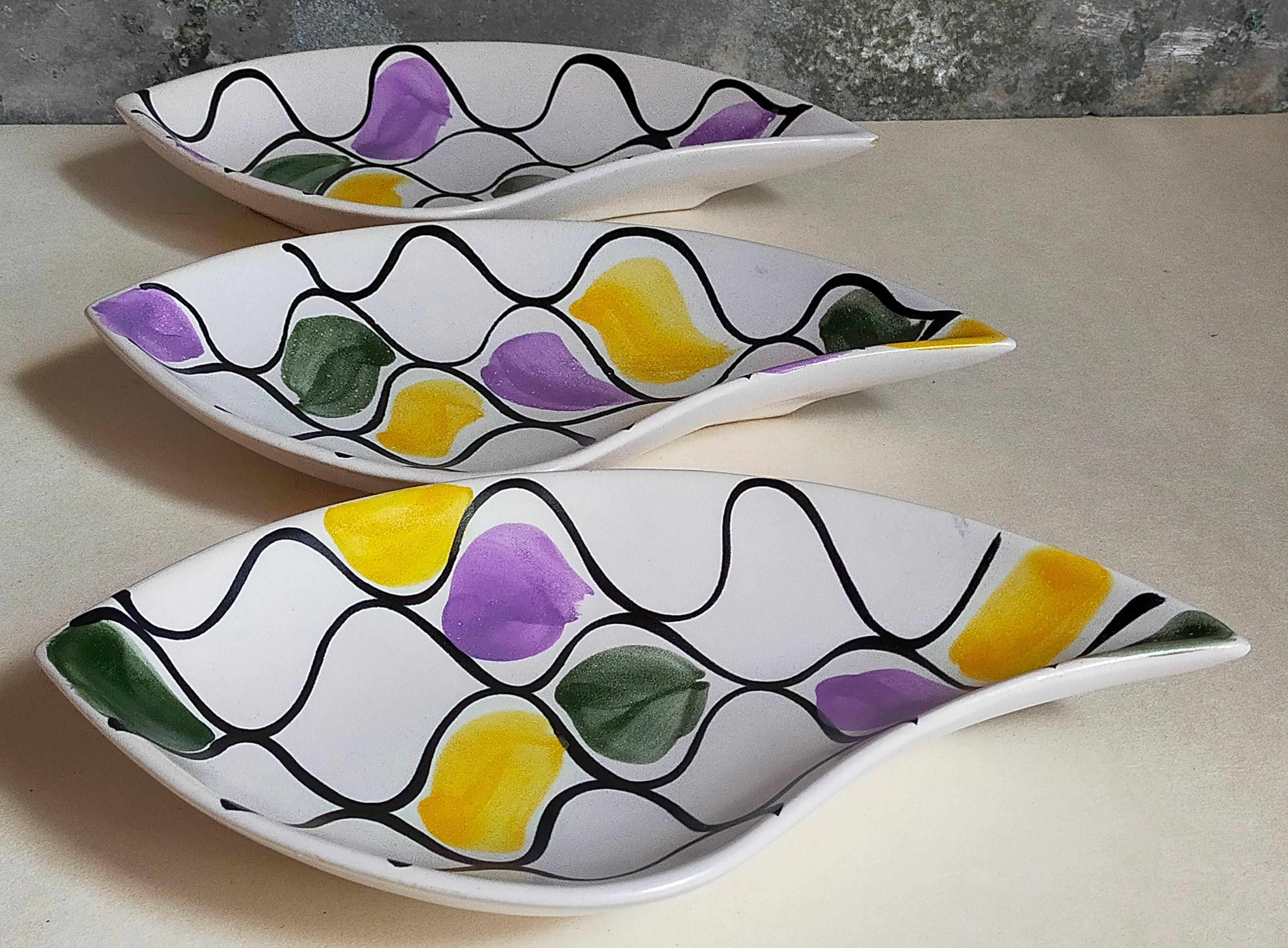 Three vintage free-form ceramic ravine dishes from the 1950s