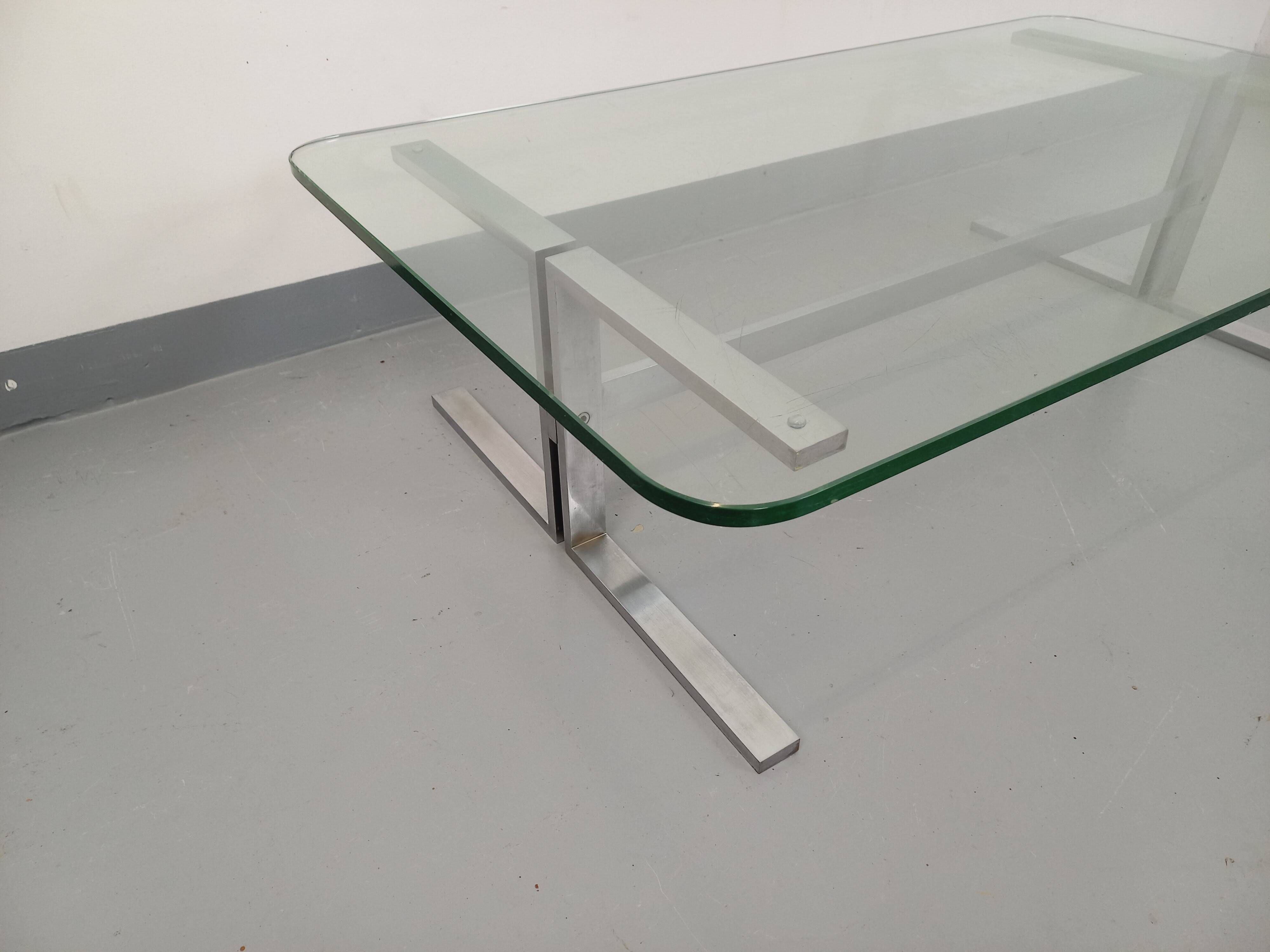 Vintage coffee table in transparent glass and cast aluminum from the 70s