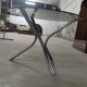 Tripod table in chrome steel and tray in smoked glass circa 1970