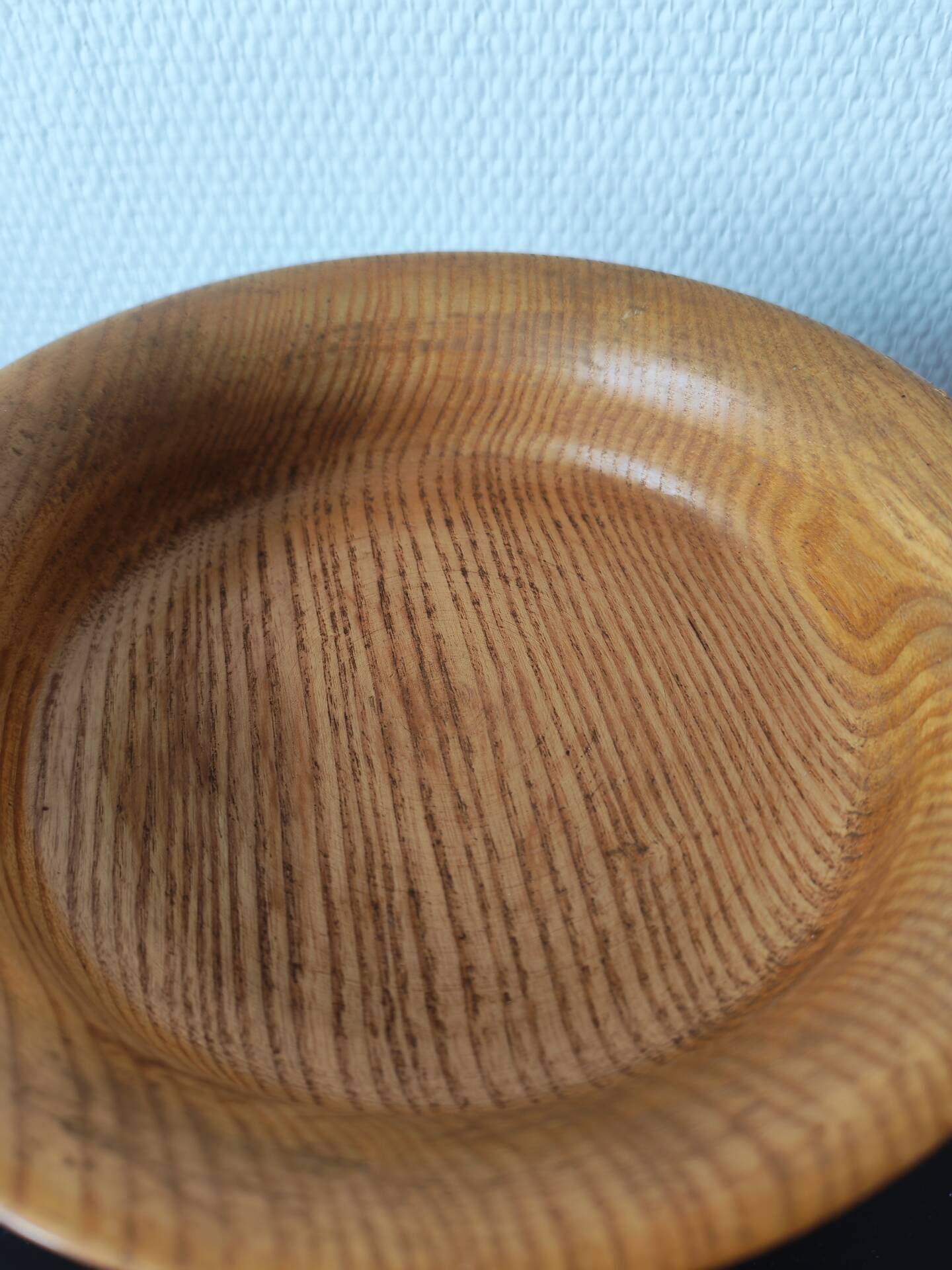 Vintage decor trio: candlestick and light wood bowls in Scandinavian style.