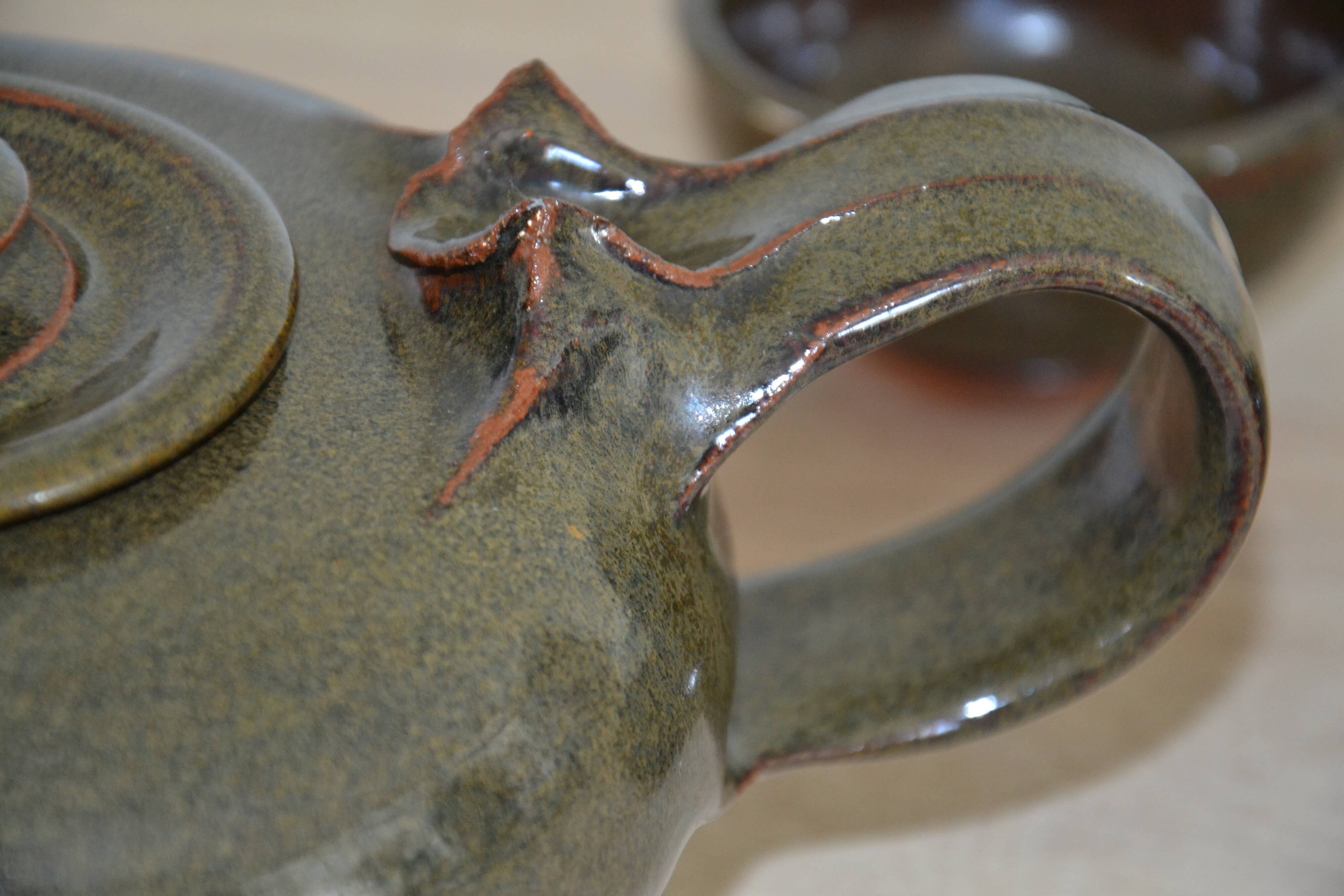 Antique stoneware teapot and its six signed bowls