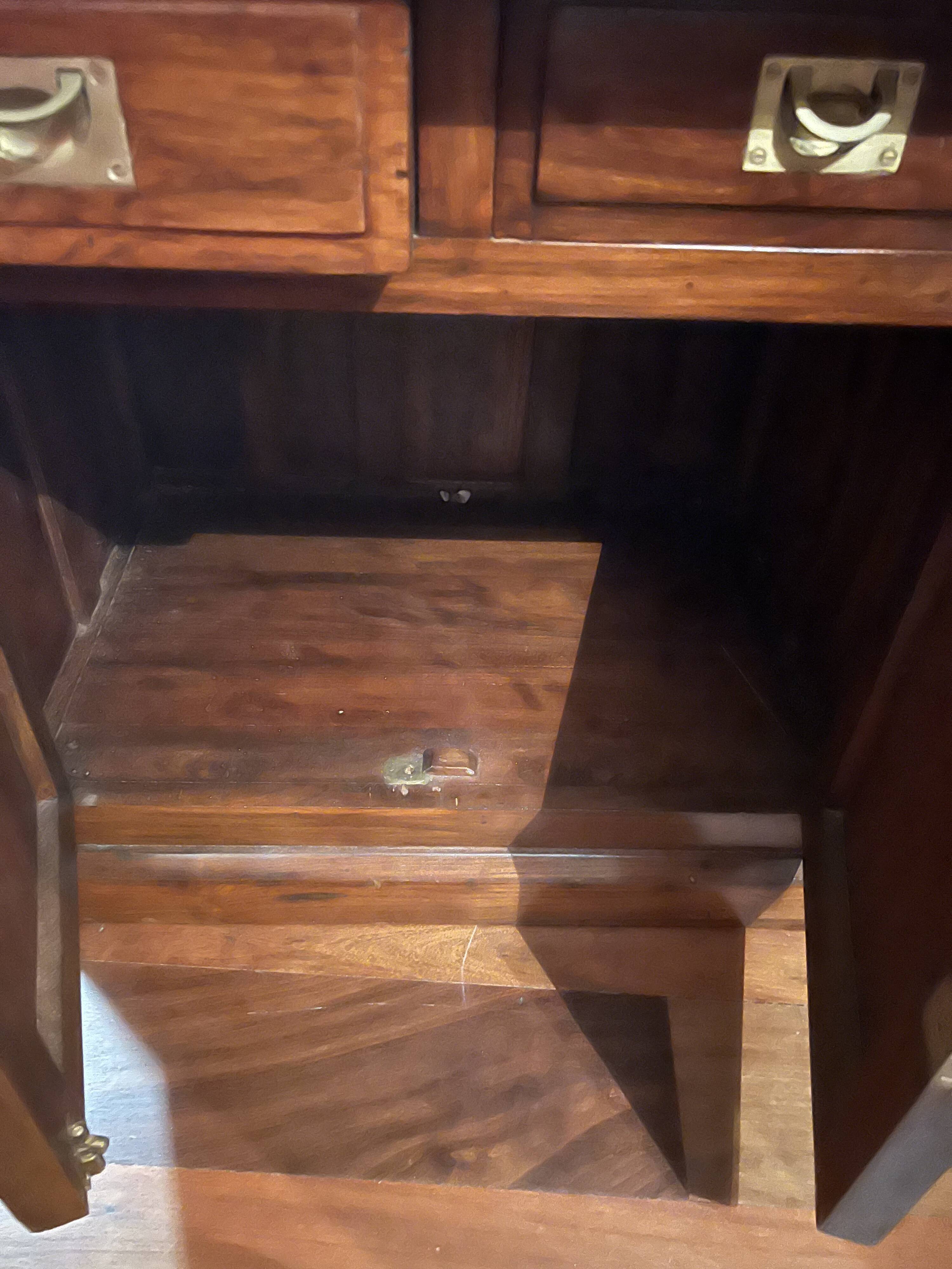 Antique solid wood secretary with a drop-down cylinder compartment.