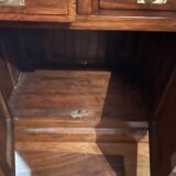 Antique solid wood secretary with a drop-down cylinder compartment.