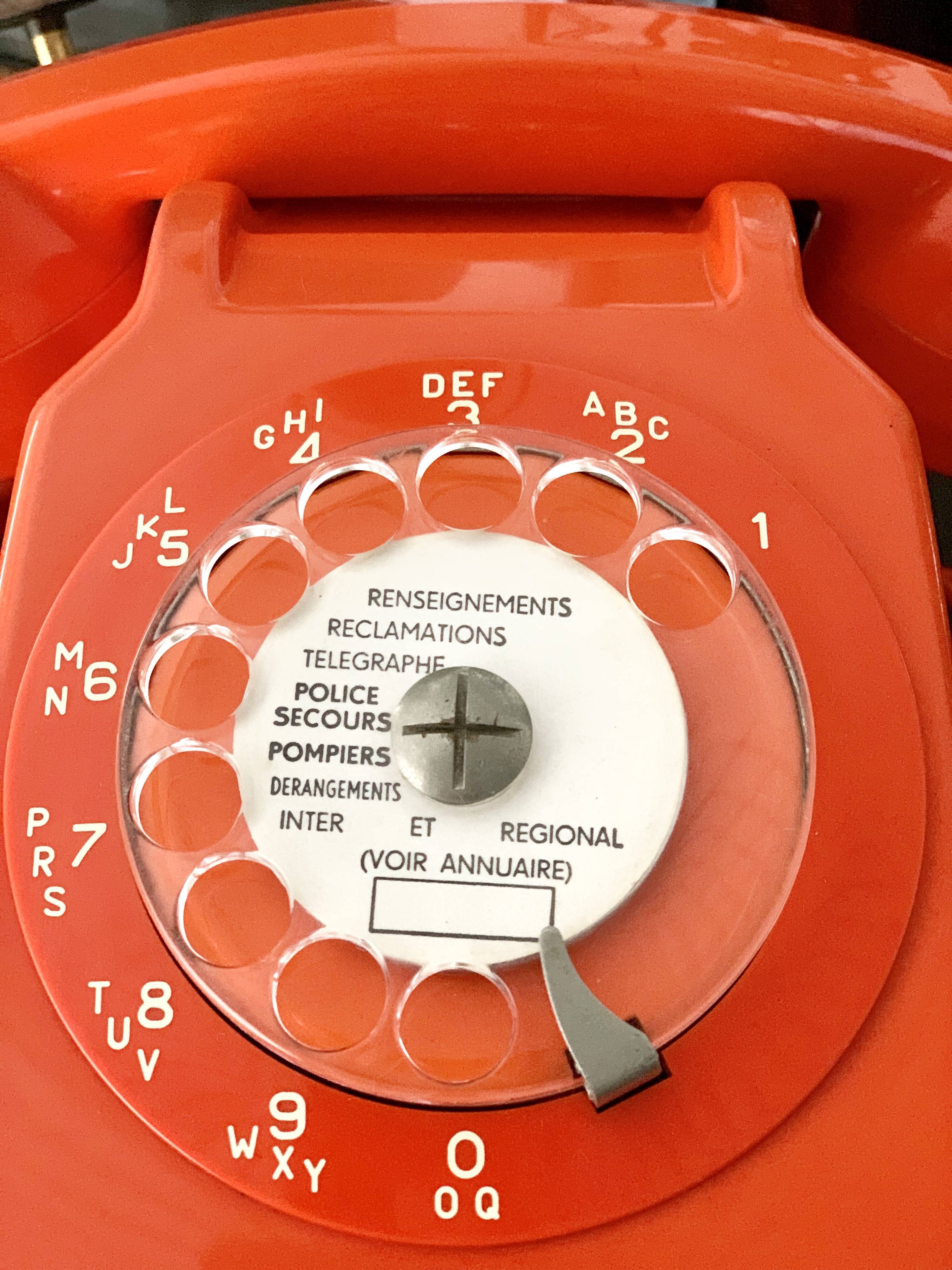 Old orange vintage dial phone