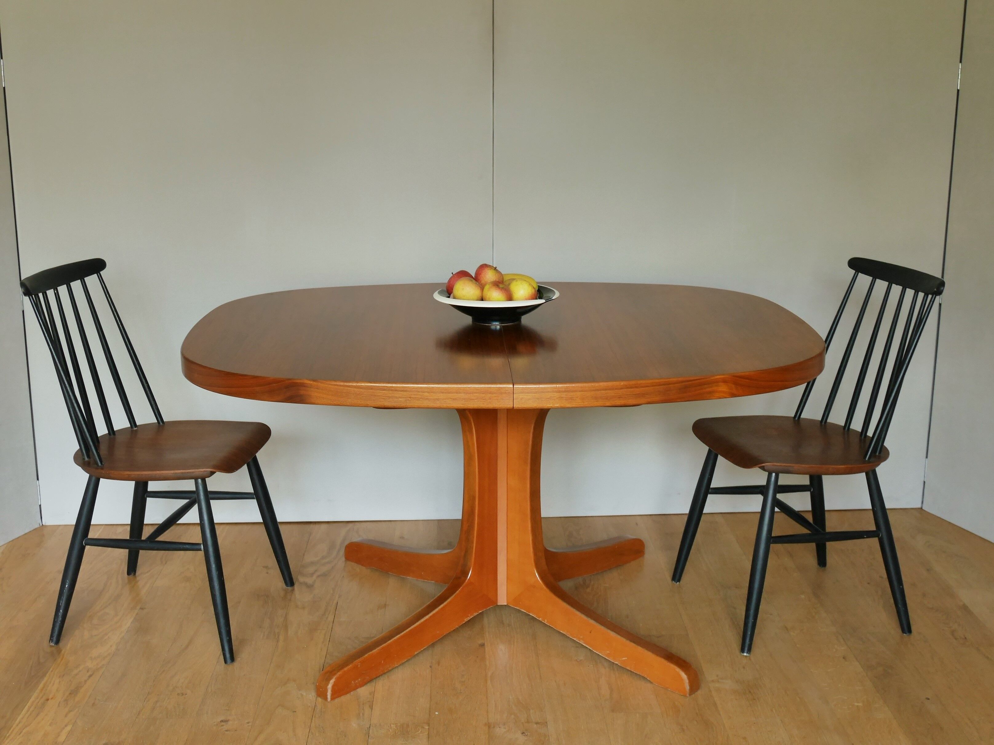 Baumann oval walnut table with extension cords