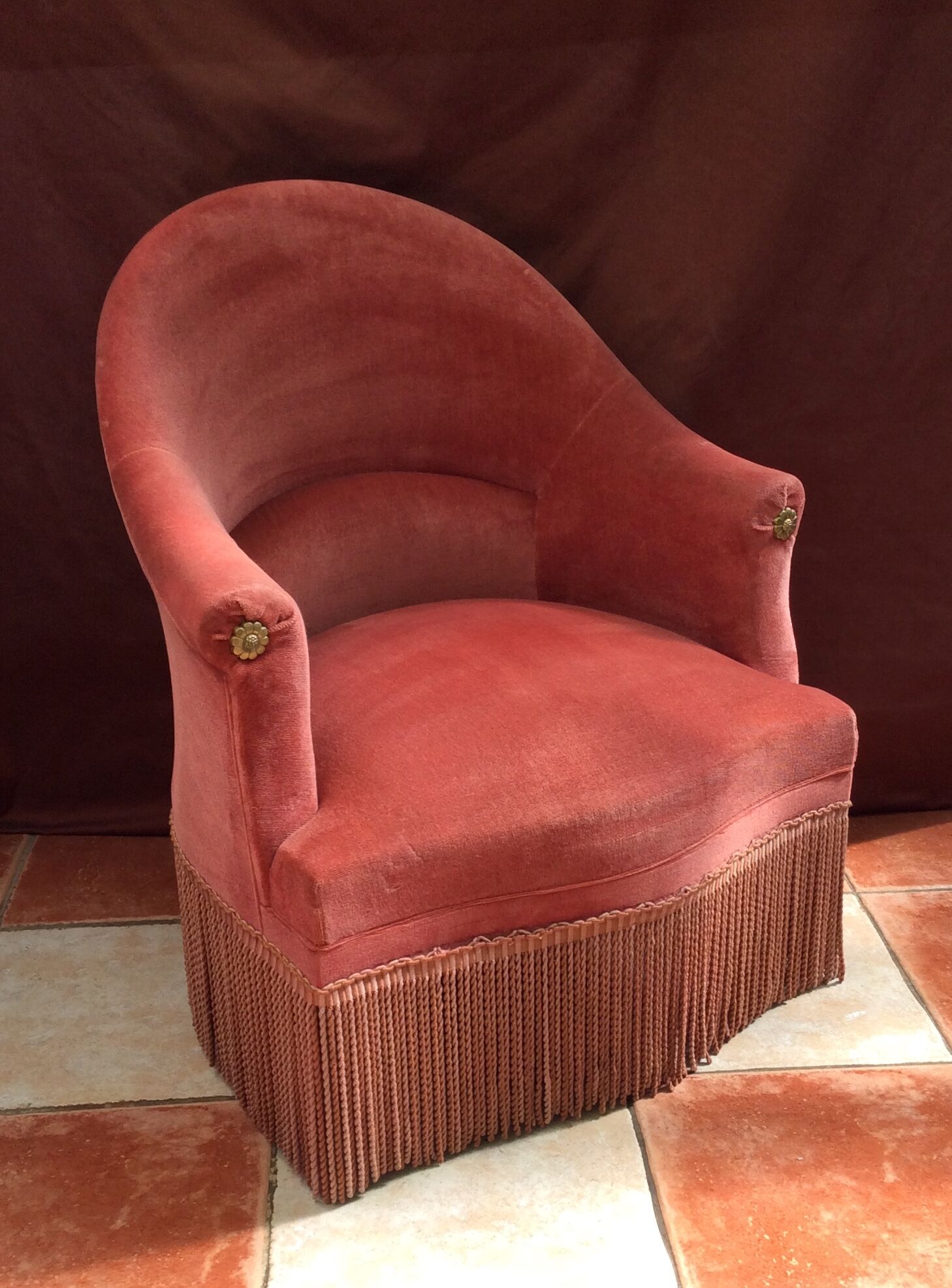 Pink velvet toad chair in the 1960s
