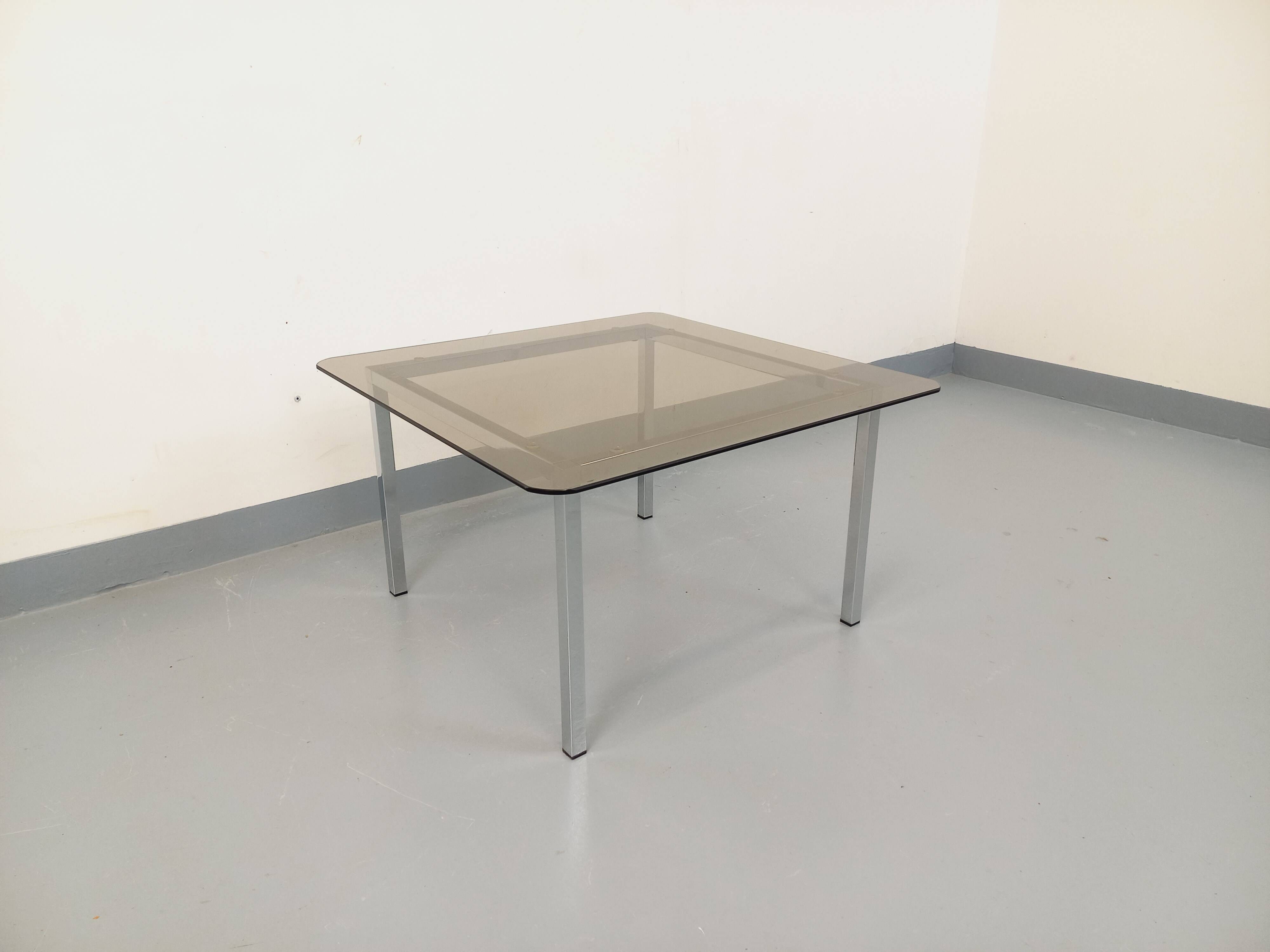 Vintage square coffee table in smoked glass and chrome metal from the 1970s.