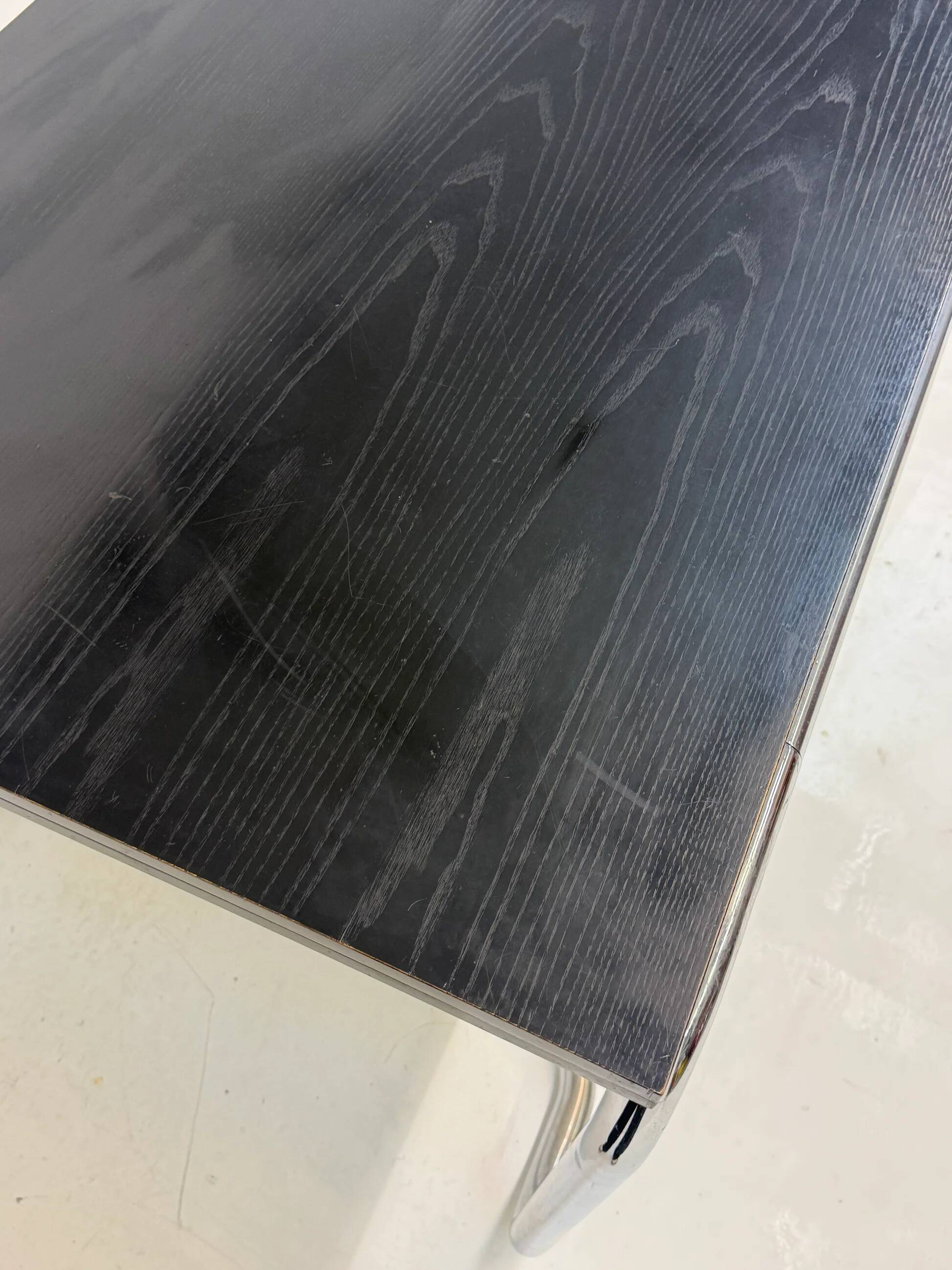 Acerbis dining table with black oak top by Giotto Stoppino