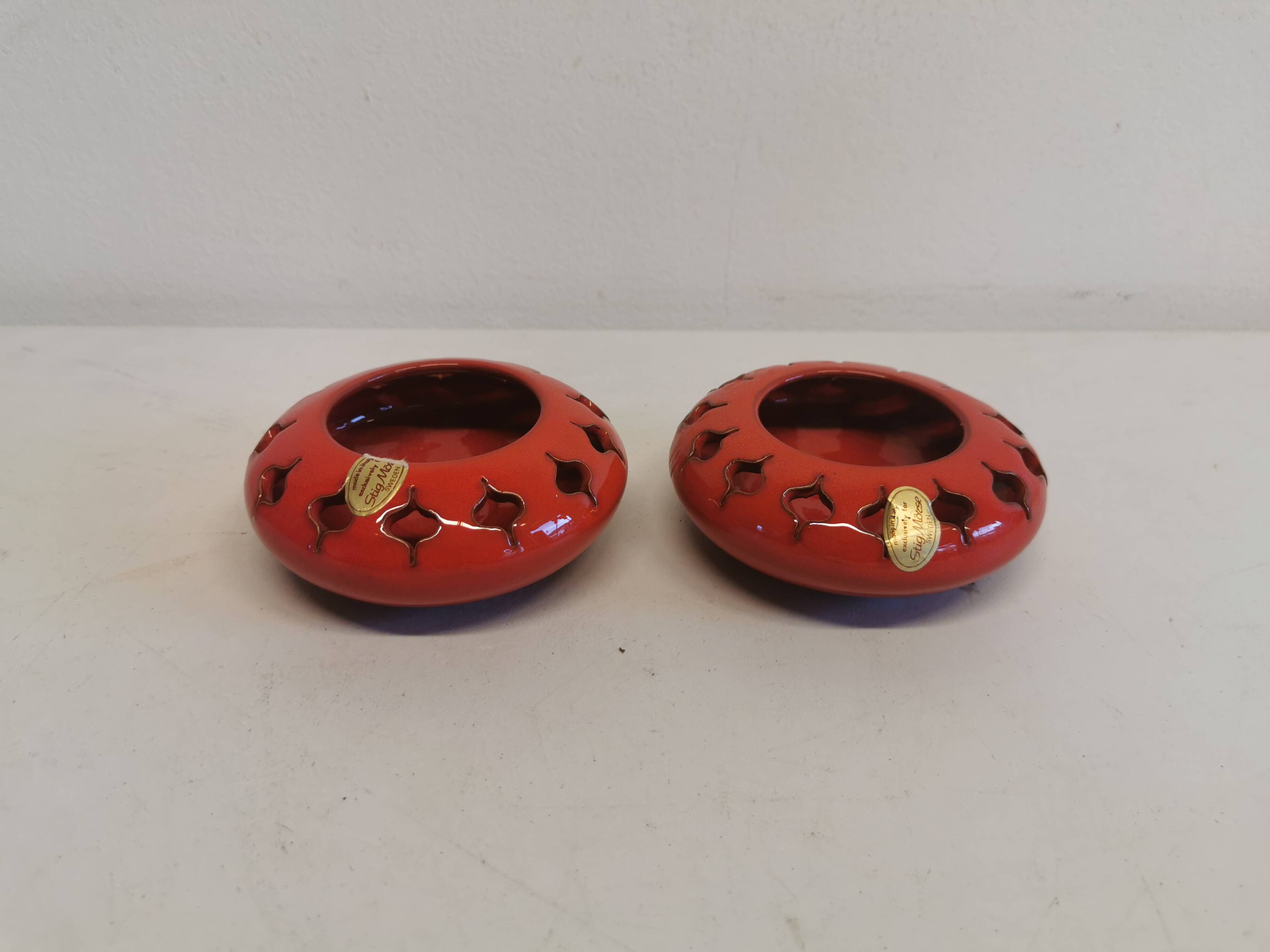 Pair of candle holders from the 1960s-1970s, crafted in red ceramic