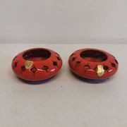 Pair of candle holders from the 1960s-1970s, crafted in red ceramic