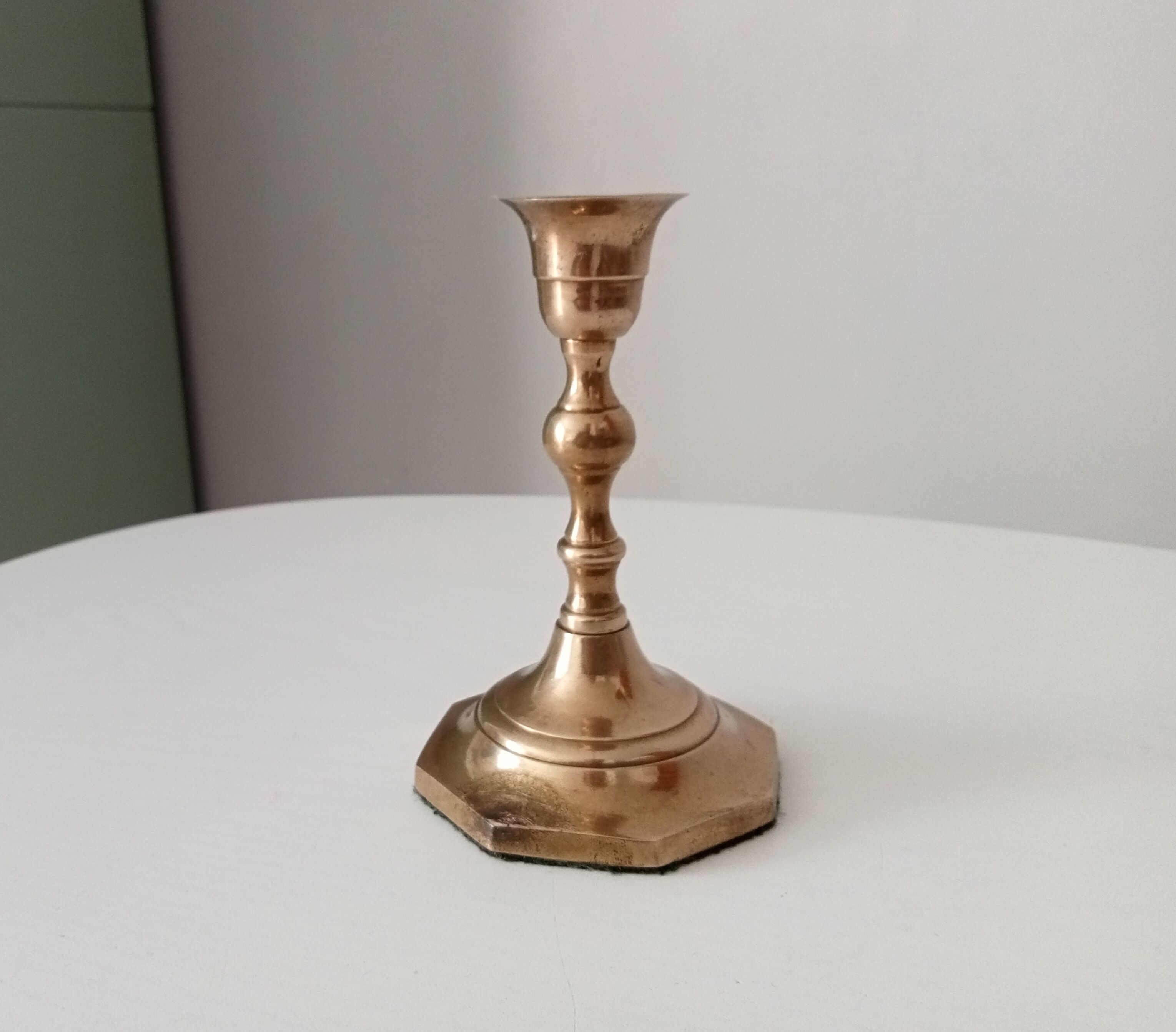 Antique candle holder in solid brass