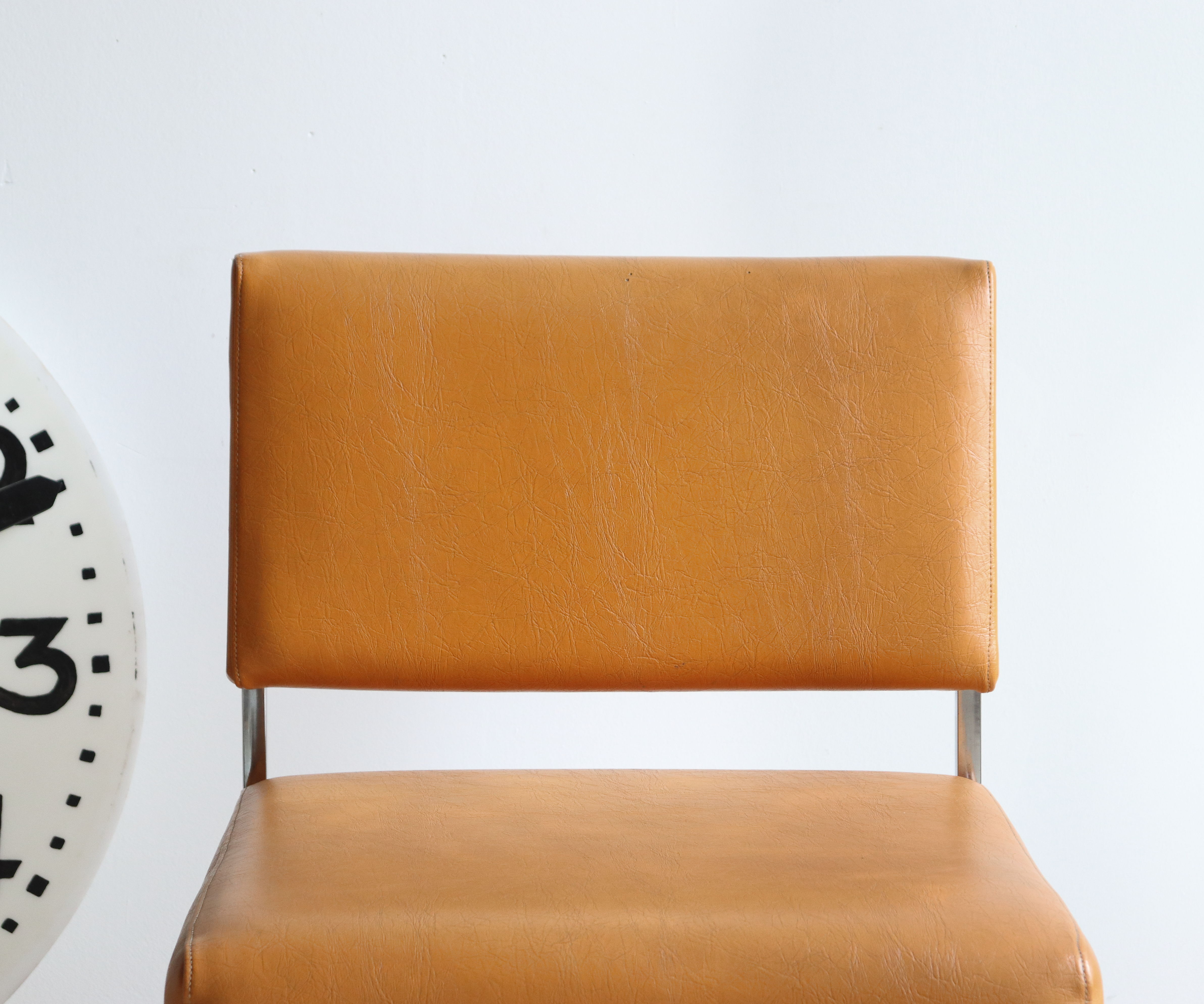 Modernist armchair in chromed metal and imitation leather, 50s/60s