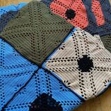 Hand-knitted patchwork blanket
