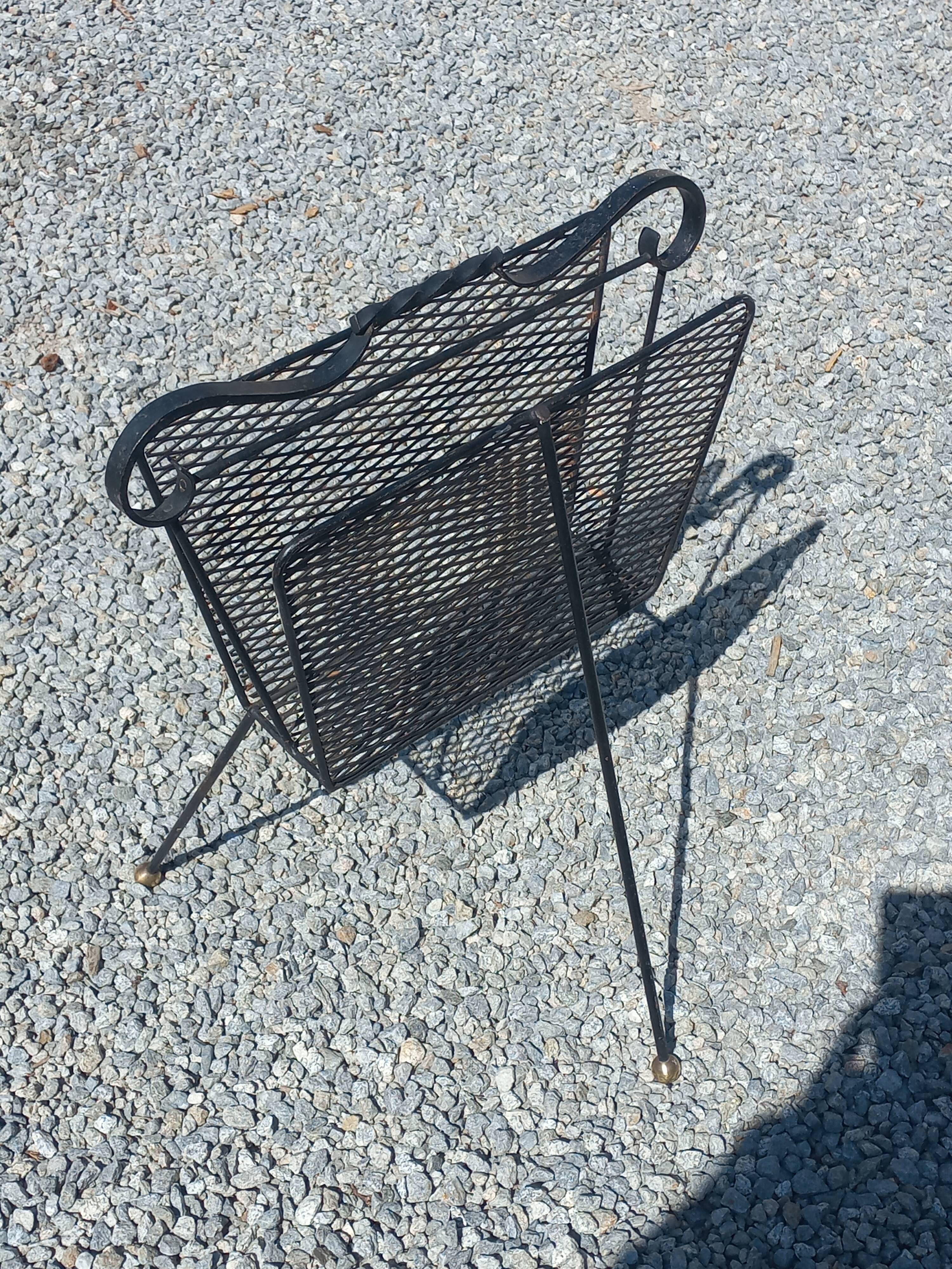 Perforated metal magazine rack from the 1960s.