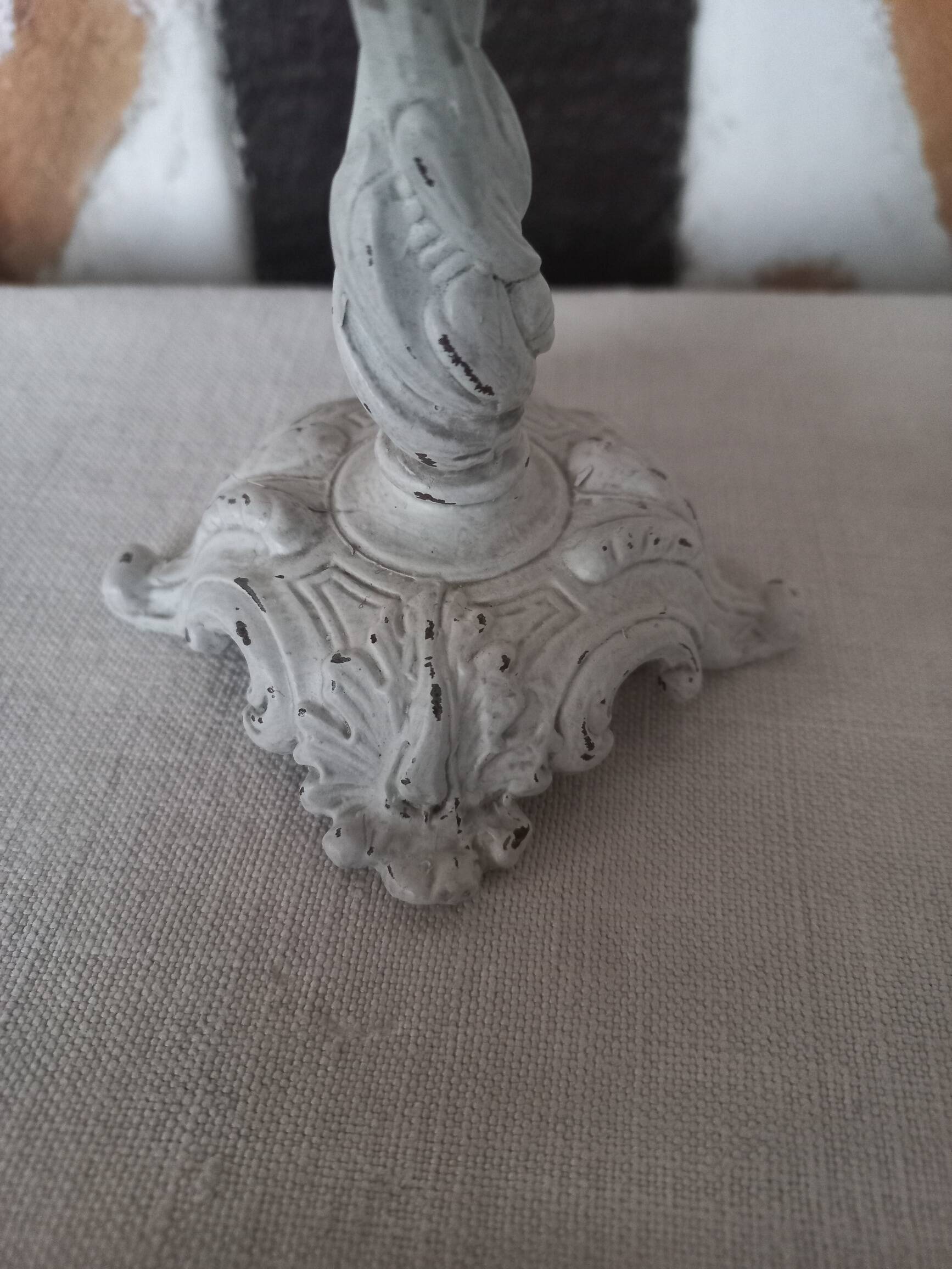 Old grayed white patinated candle holder