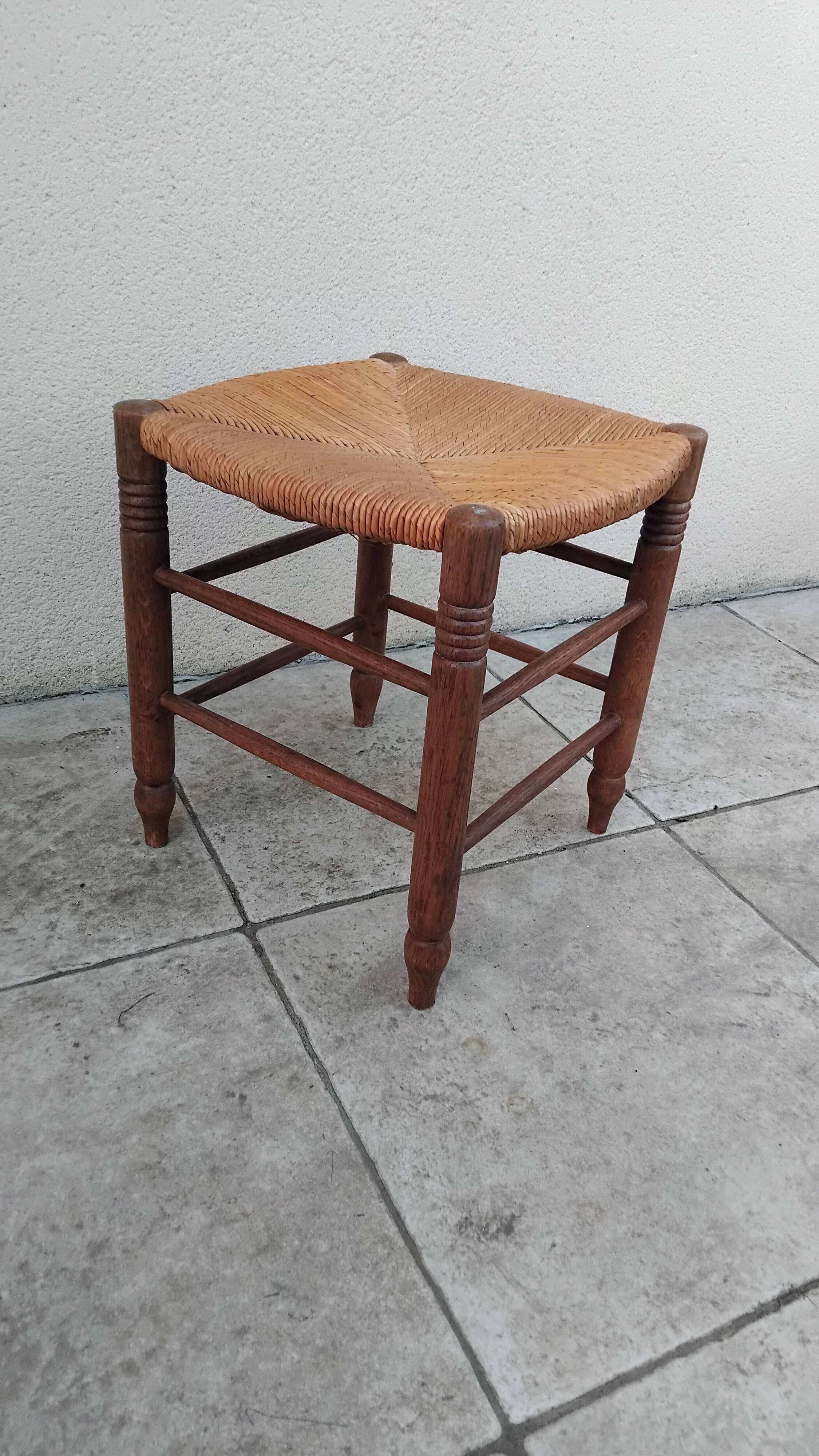 Vintage low stool with straw seat
