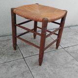 Vintage low stool with straw seat