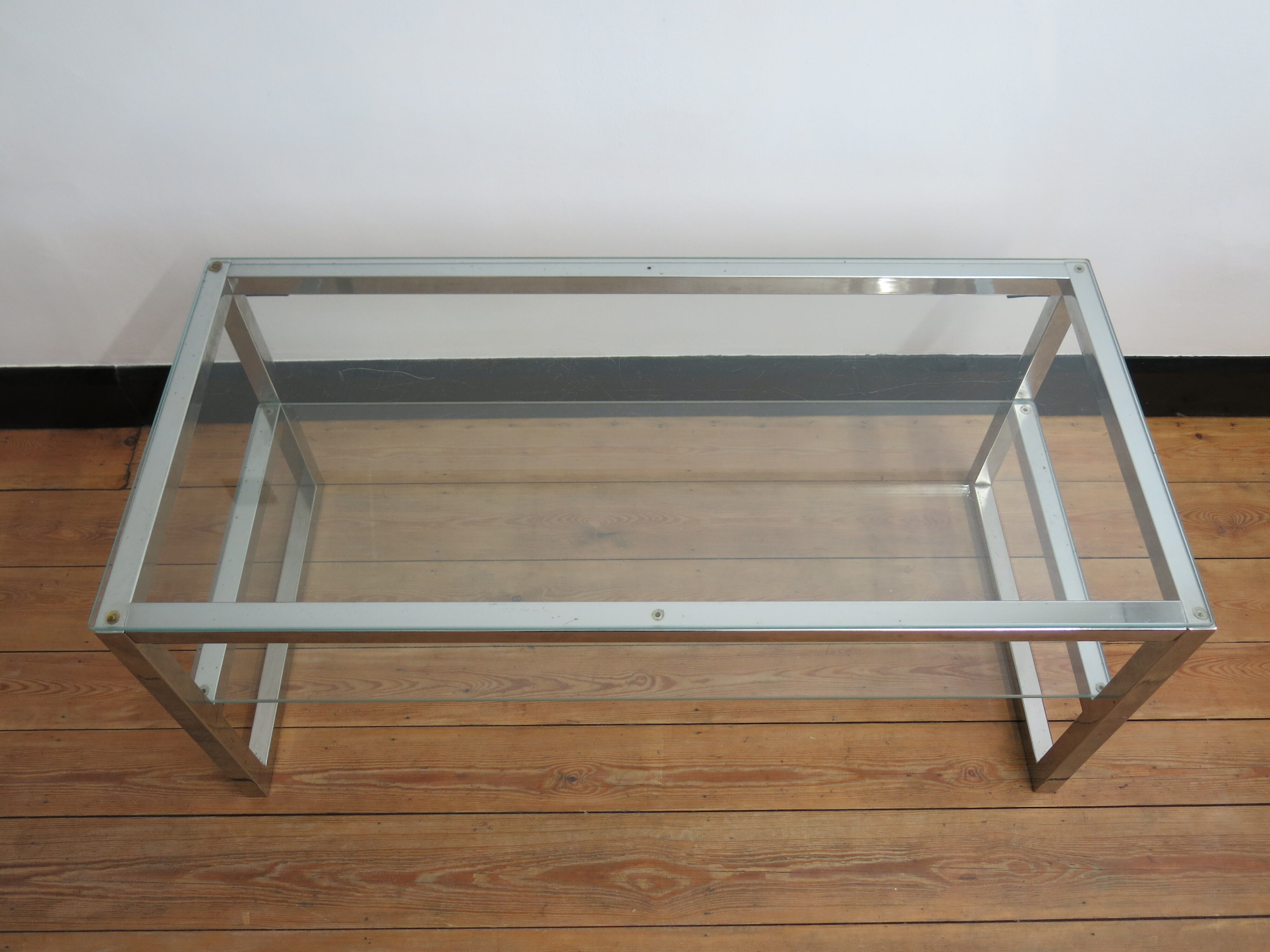 Coffee table in glass and chromed metal