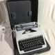 Machine à ecrire Olympia métal gris avec malle noire germany vintage