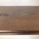 antique oak wall shelf with carved brackets