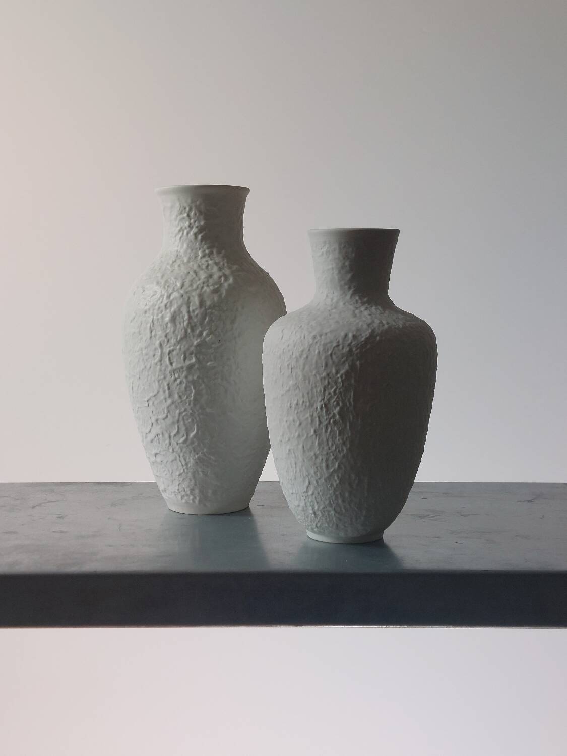 Pair of vintage biscuit porcelain vases by Metzler Ortloff