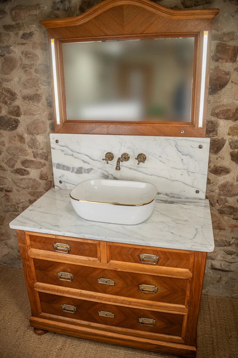 Antique washbasin cabinet from 1928 in wood and marble with a lighted mirror.