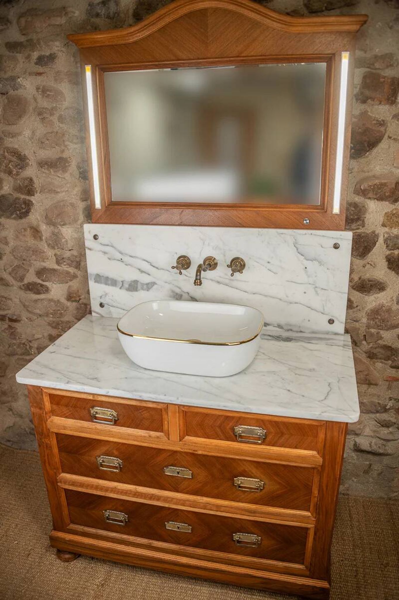 Antique washbasin cabinet from 1928 in wood and marble with illuminating mirror.