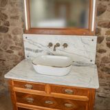 Antique washbasin cabinet from 1928 in wood and marble with a lighted mirror.