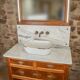 Meuble sous vasque ancien de 1928 en bois et marbre avec miroir éclairant