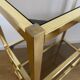 VINTAGE SHELF CONSOLE IN GOLD METAL AND SMOKED GLASS