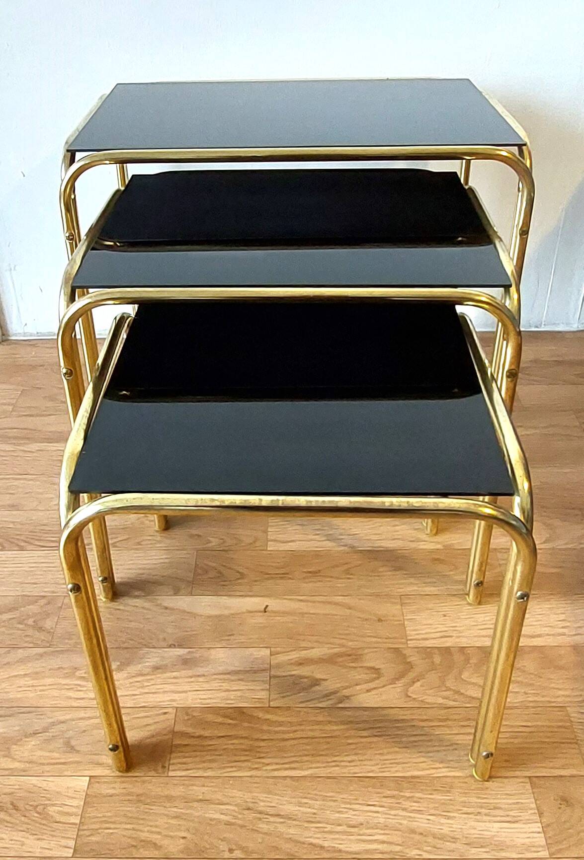 Vintage 1970 gold metal nesting tables.