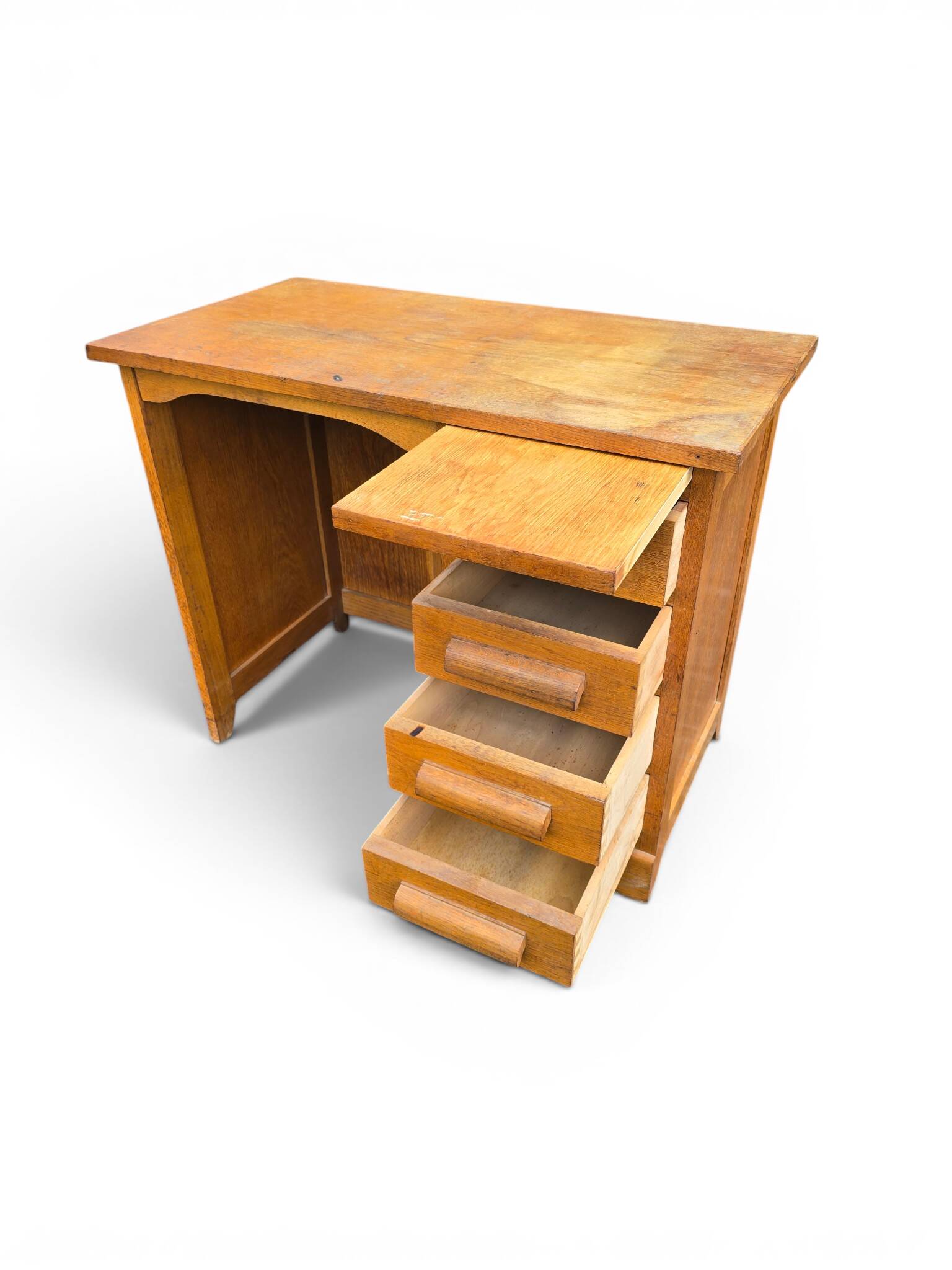 Vintage oak desk with a drawer unit and sliding shelf.