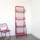 Red mesh metal grocery shelf
