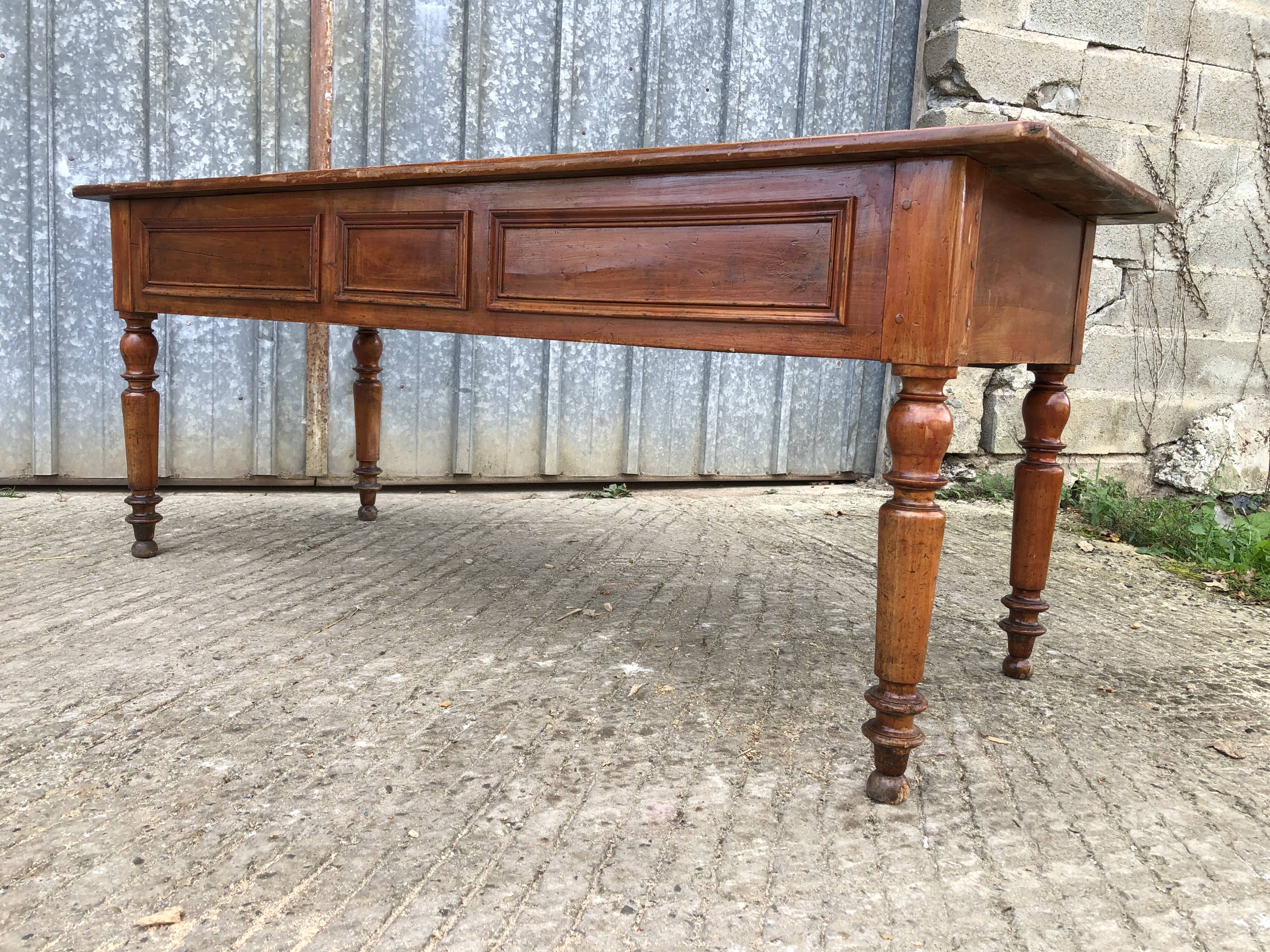 Old farmhouse table in solid cherry wood with 2 front drawers.