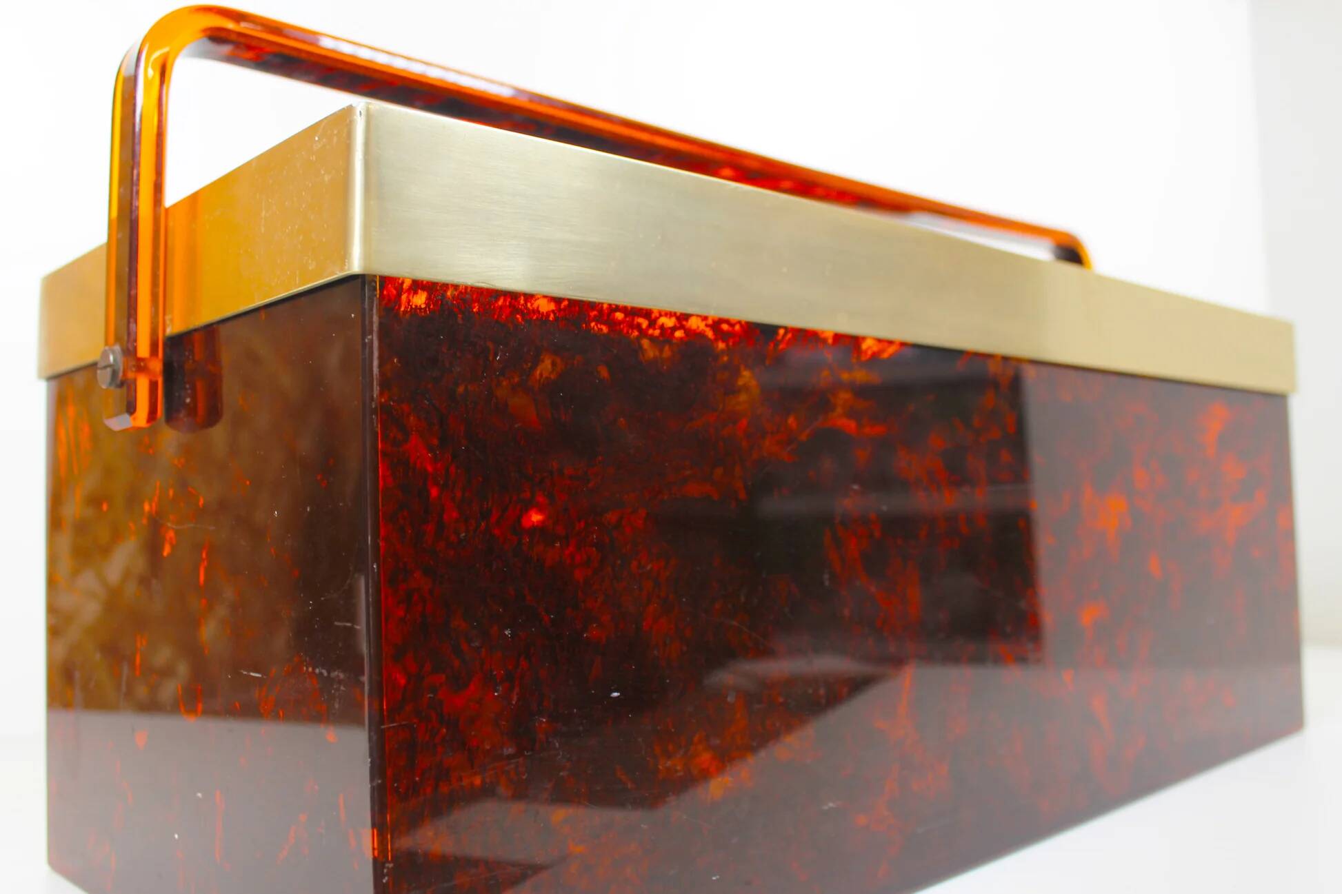 Italian magazine rack in 'faux tortoiseshell' and brass
