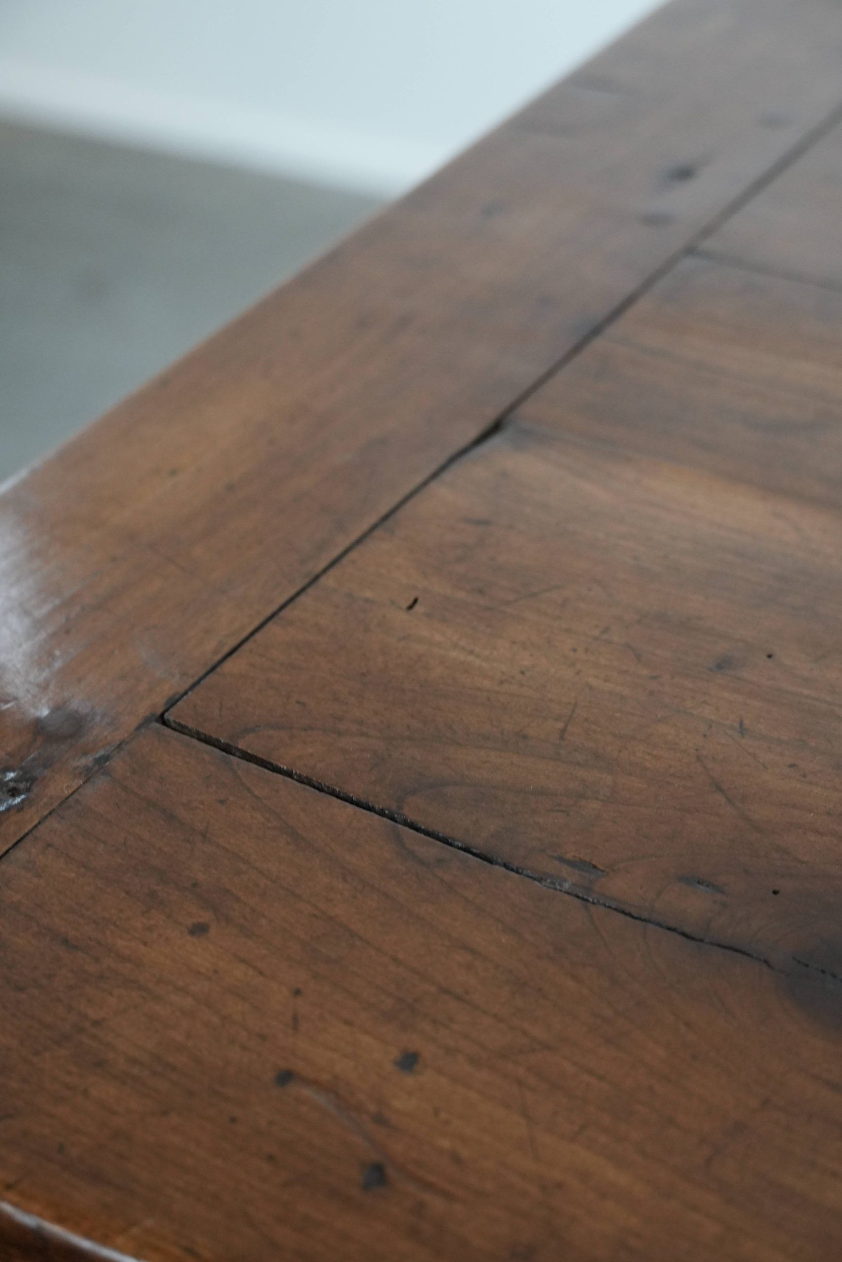 Elegant and subtle antique French dining table made of fruitwood