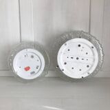Two round molded glass ceiling lights