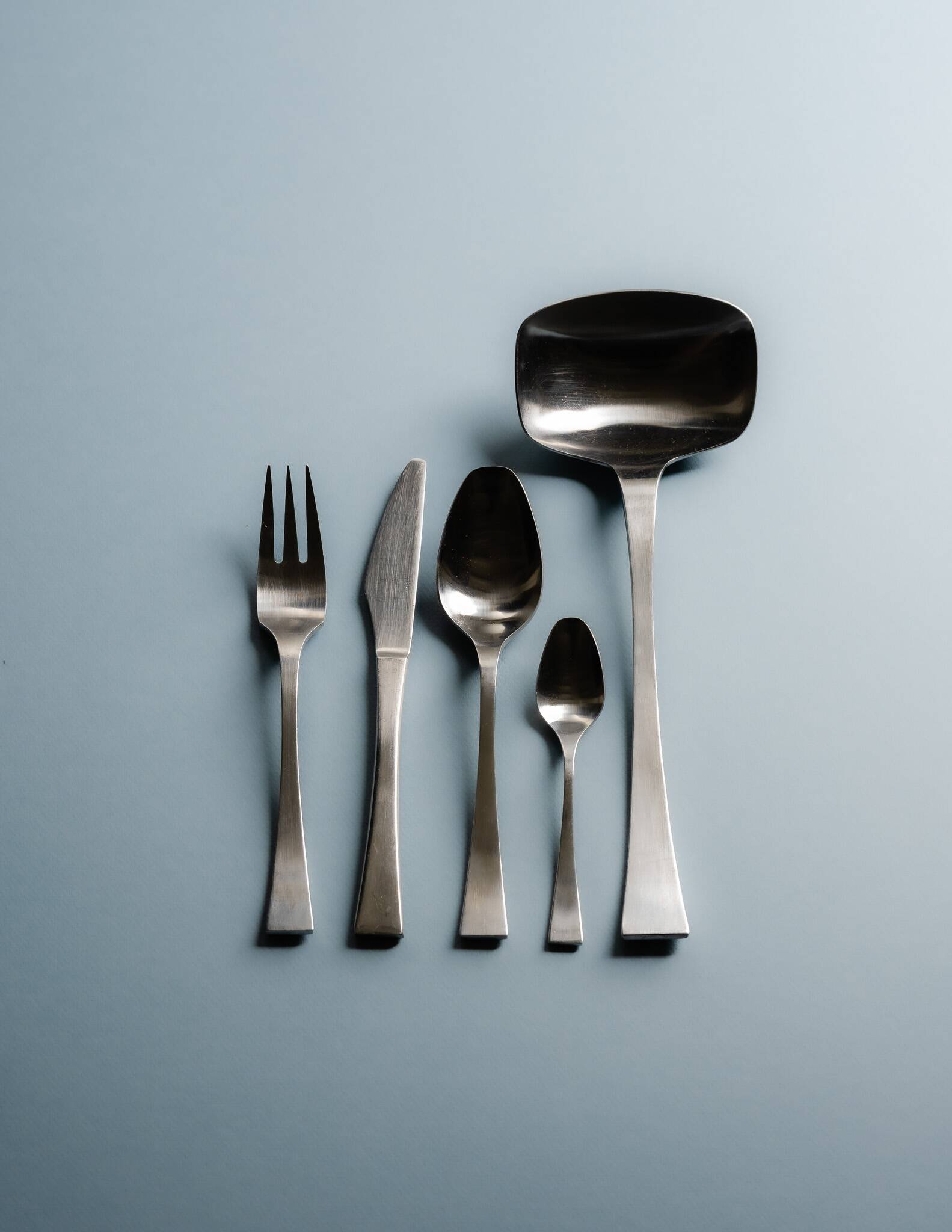 GUY DEGRENNE STAINLESS STEEL CUTLERY SET, 1970s