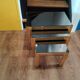 Vintage nesting table in gold metal and smoked mirror glass