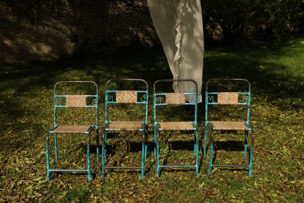 Wrought iron and rattan garden chairs