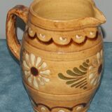 Glazed terracotta pitcher decorated with friezes and flowers