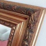 Miroir bois sculpté patine doré